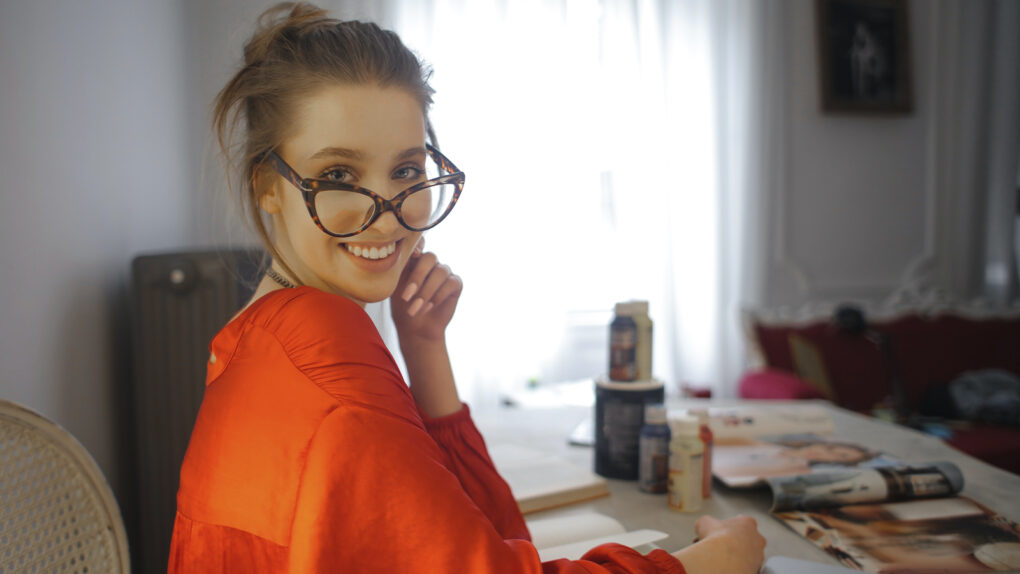 The Girl with Glasses at the Table